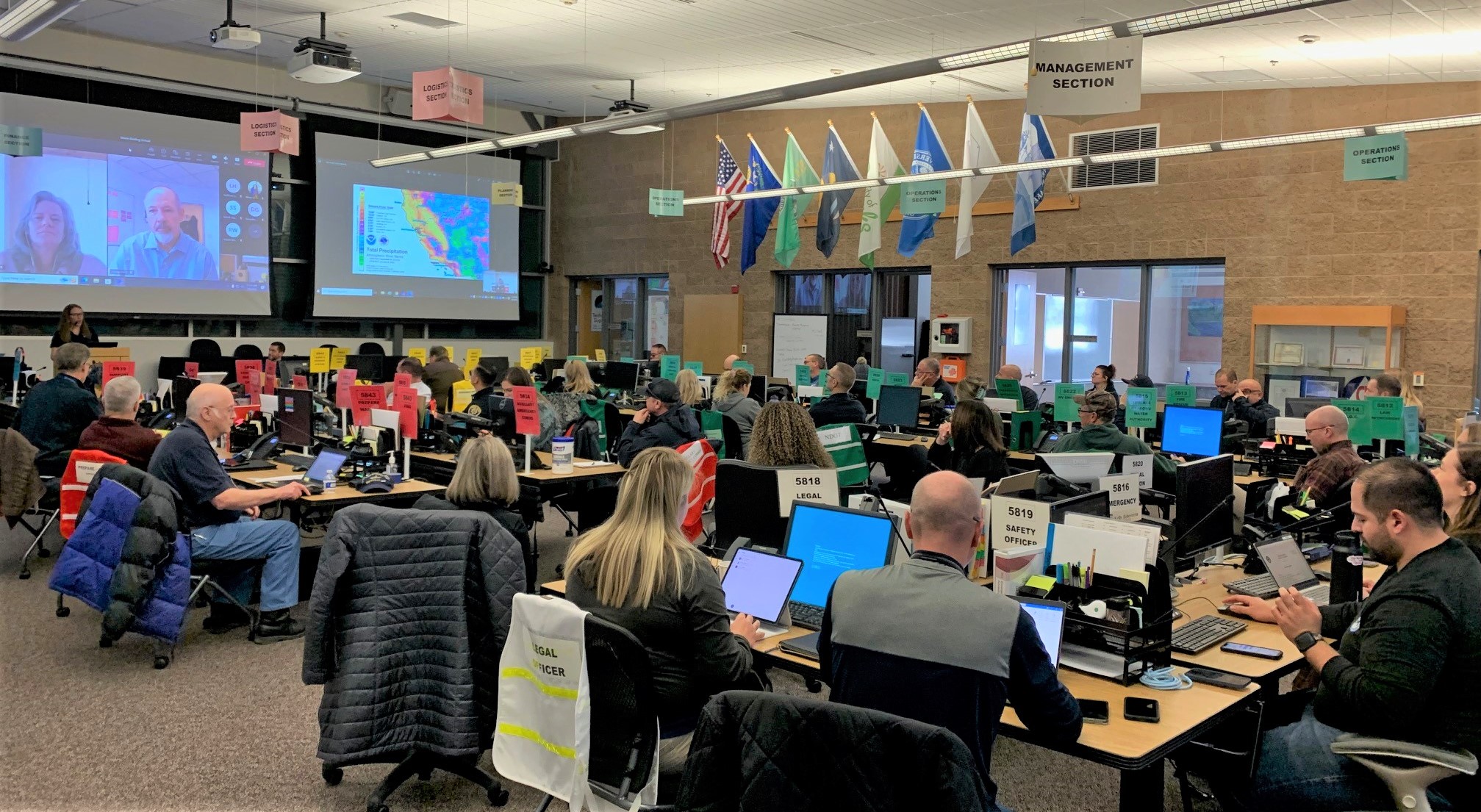 Staff from local governments and emergency response gather at the Regional Emergency Operations Center to coordinate efforts ahead of the next storm.