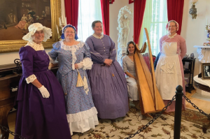 Docents dressed up in 1800s fashion inside Bowers Mansion.