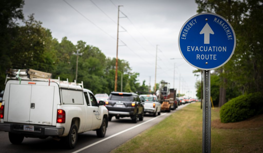 Emergency Evacuation Route sign and Vehicles