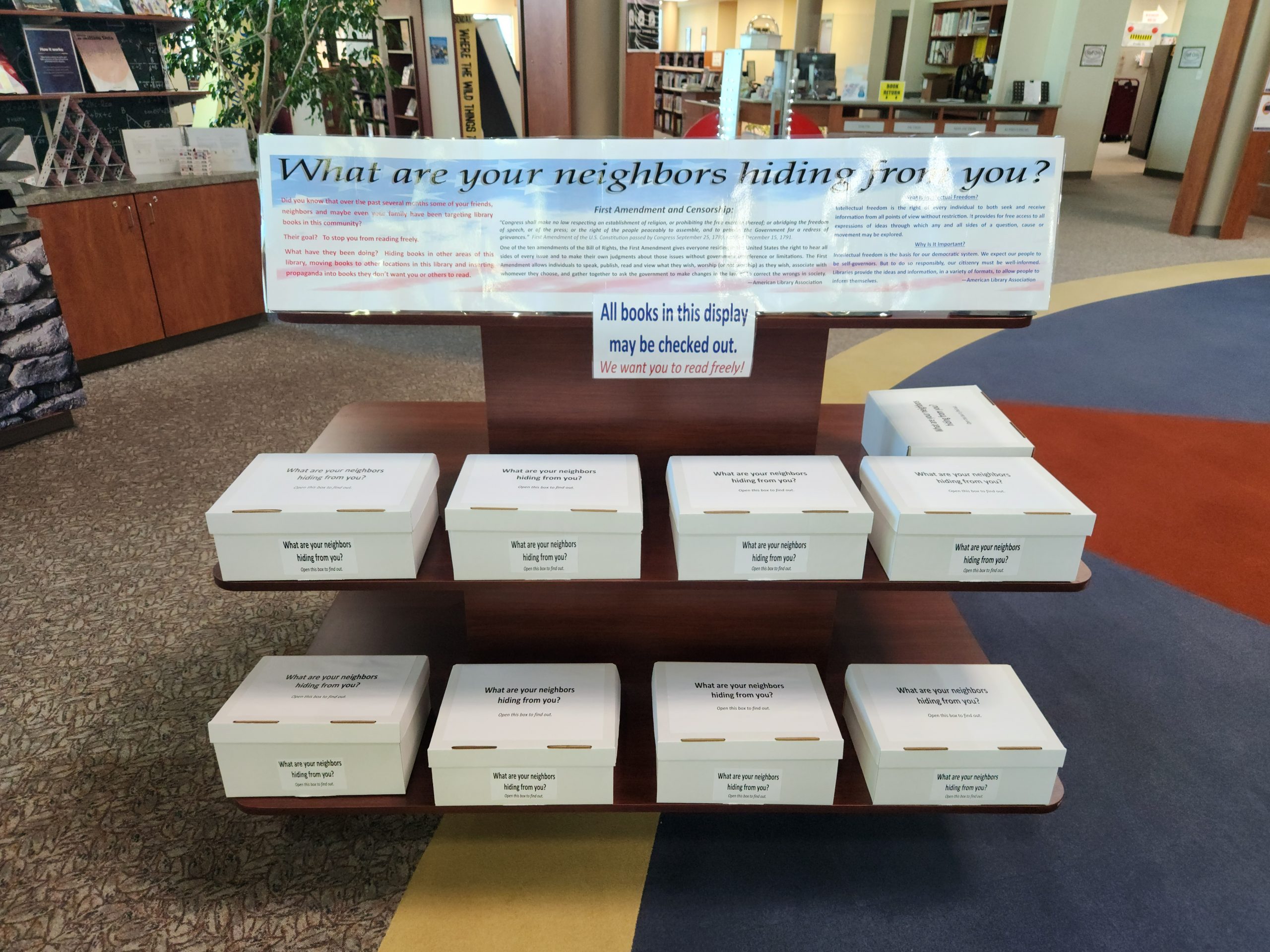 The "What are your neighbors hiding from you" display at the Spanish Springs Library features titles that have been damaged and hidden by unknown members of the public to prevent patron access.