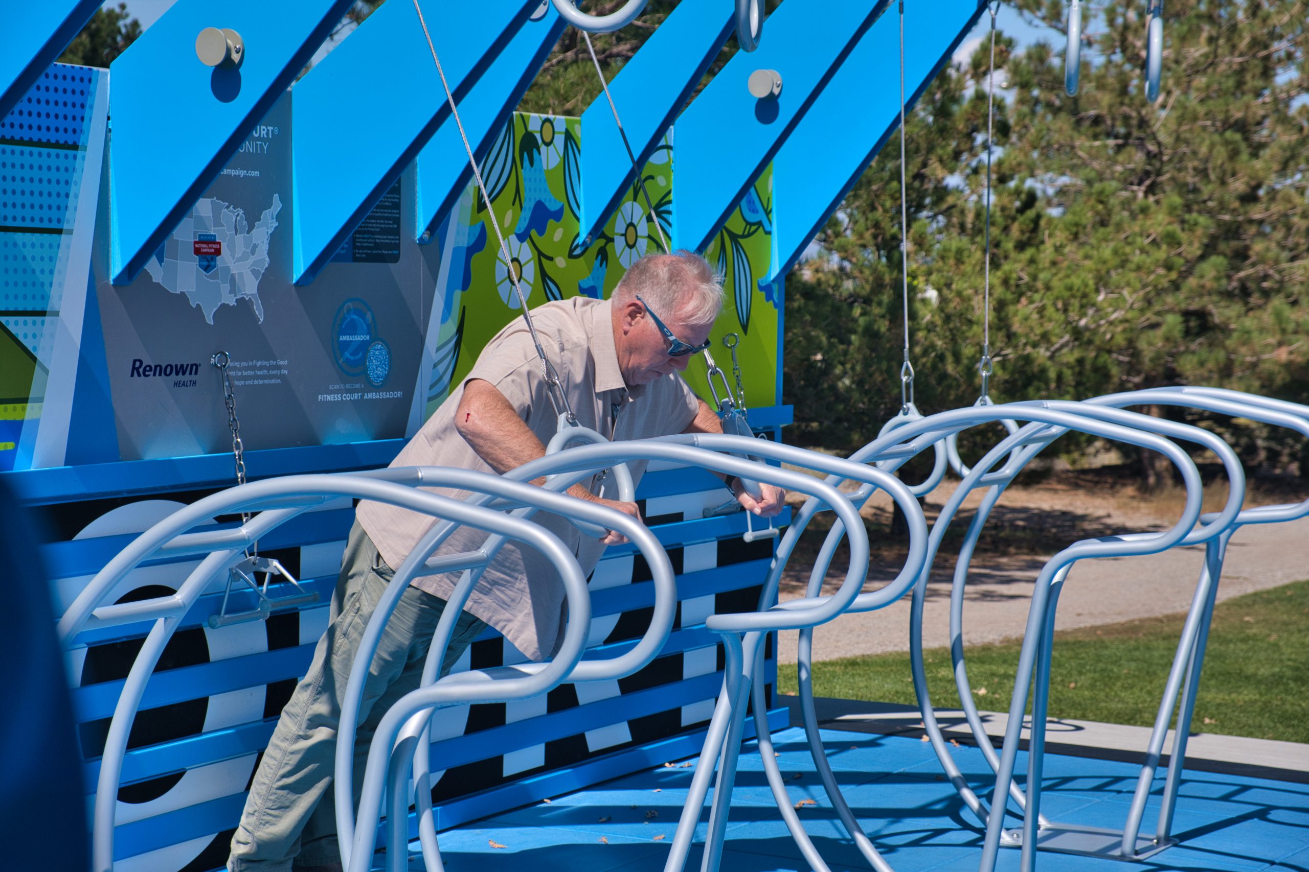 Commissioner Clark using fitness equipment. 