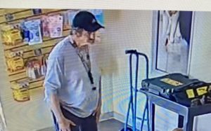 image of adult male in white sweater and black hat. 