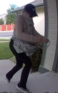 Porch pirate suspect on home surveillance footage 1