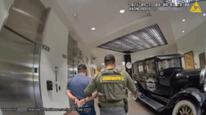 Arrest of Alfred Adams in ICAC Investigation. Suspect escorted by WCSO Deputy into Washoe County Detention Facility
