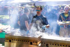 Undersheriff Solferino grilling burgers at the 2024 Incline Picnic
