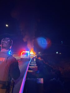 Washoe County Deputy responding to scene with a vehicle on fire.