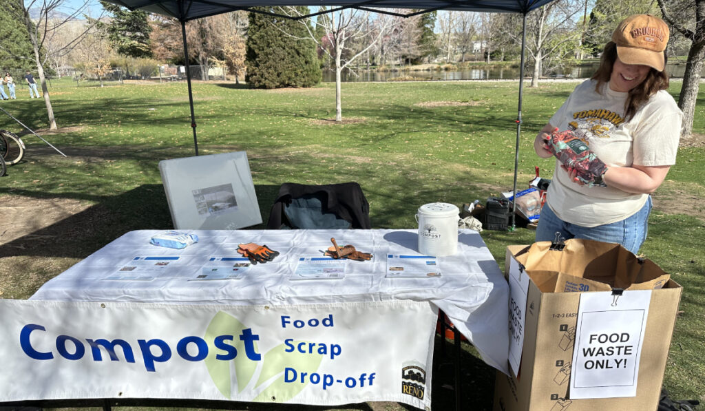 woman dumping food scraps into bin at farmers market