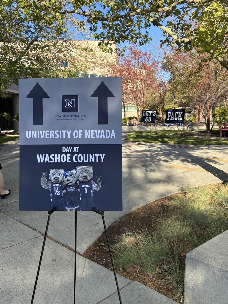 Photo of a directional sign saying University of Nevada day at Washoe County.