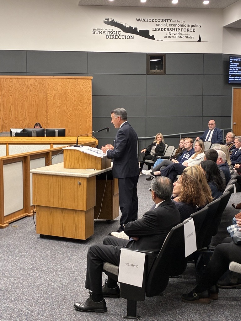 Photo of UNR President Brian Sandoval speaking at a county commission meeting.