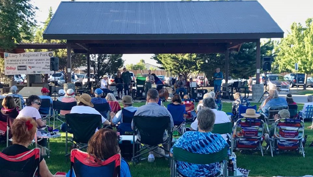 Lazy 5 Summer-Concert photo of people watching a concert in a park
