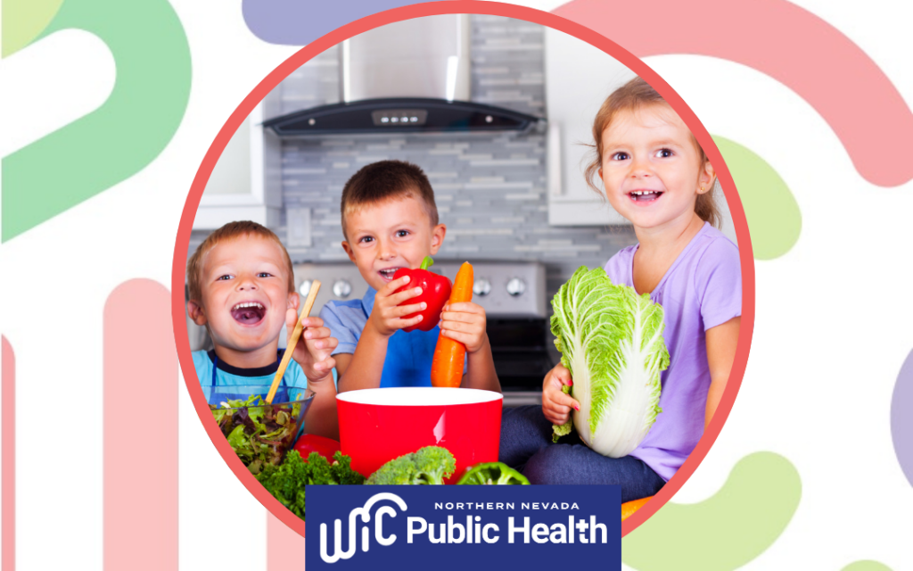 Children sit at a kitchen counter holding vegetables, with WIC and Northern Nevada Public Health logos shown in center of a decorative background.